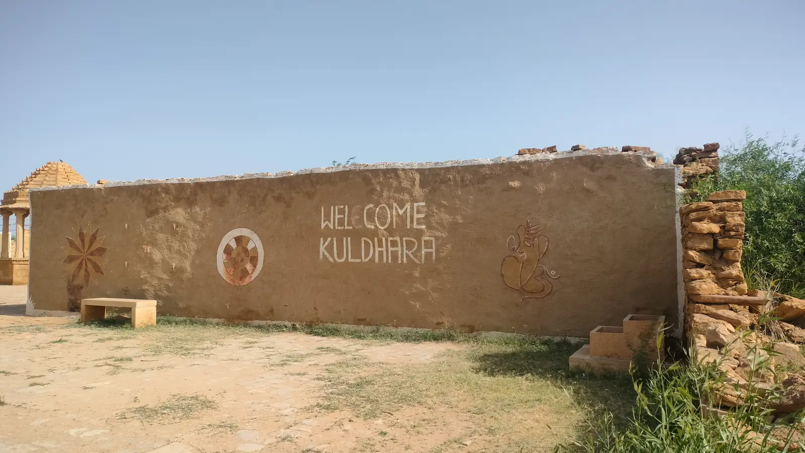 The painted welcome wall at Kuldhara, the abandoned village on the way out