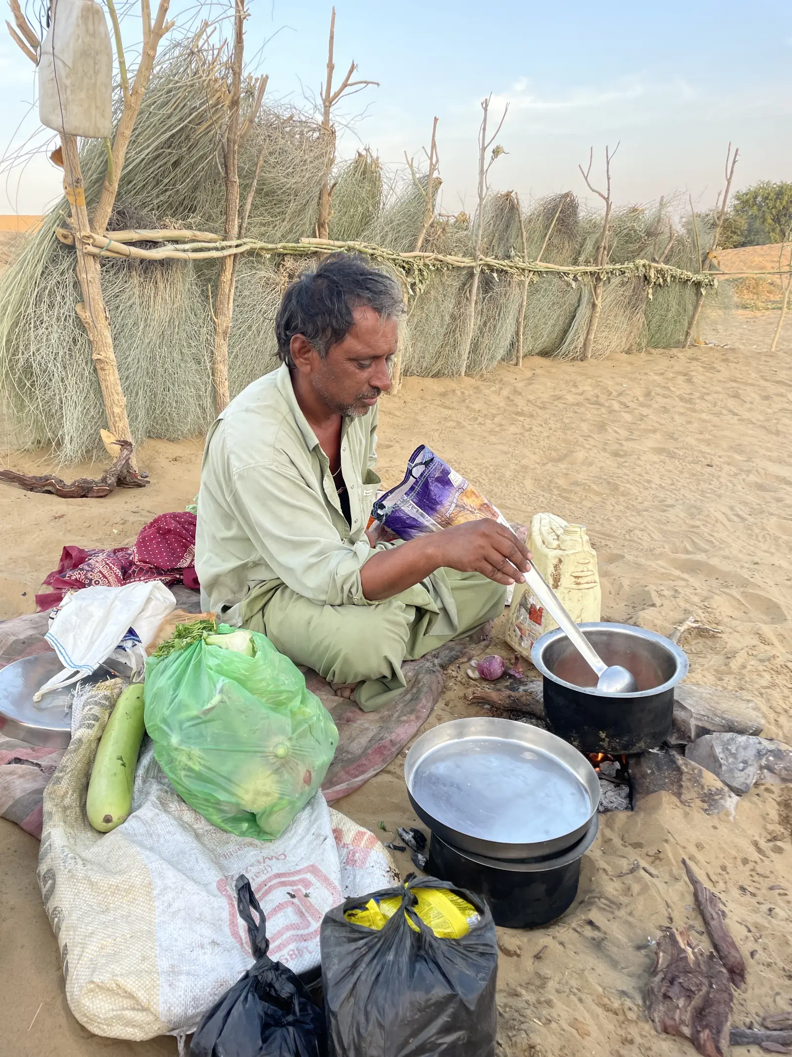 The cook preparing dinner at the camp kitchen