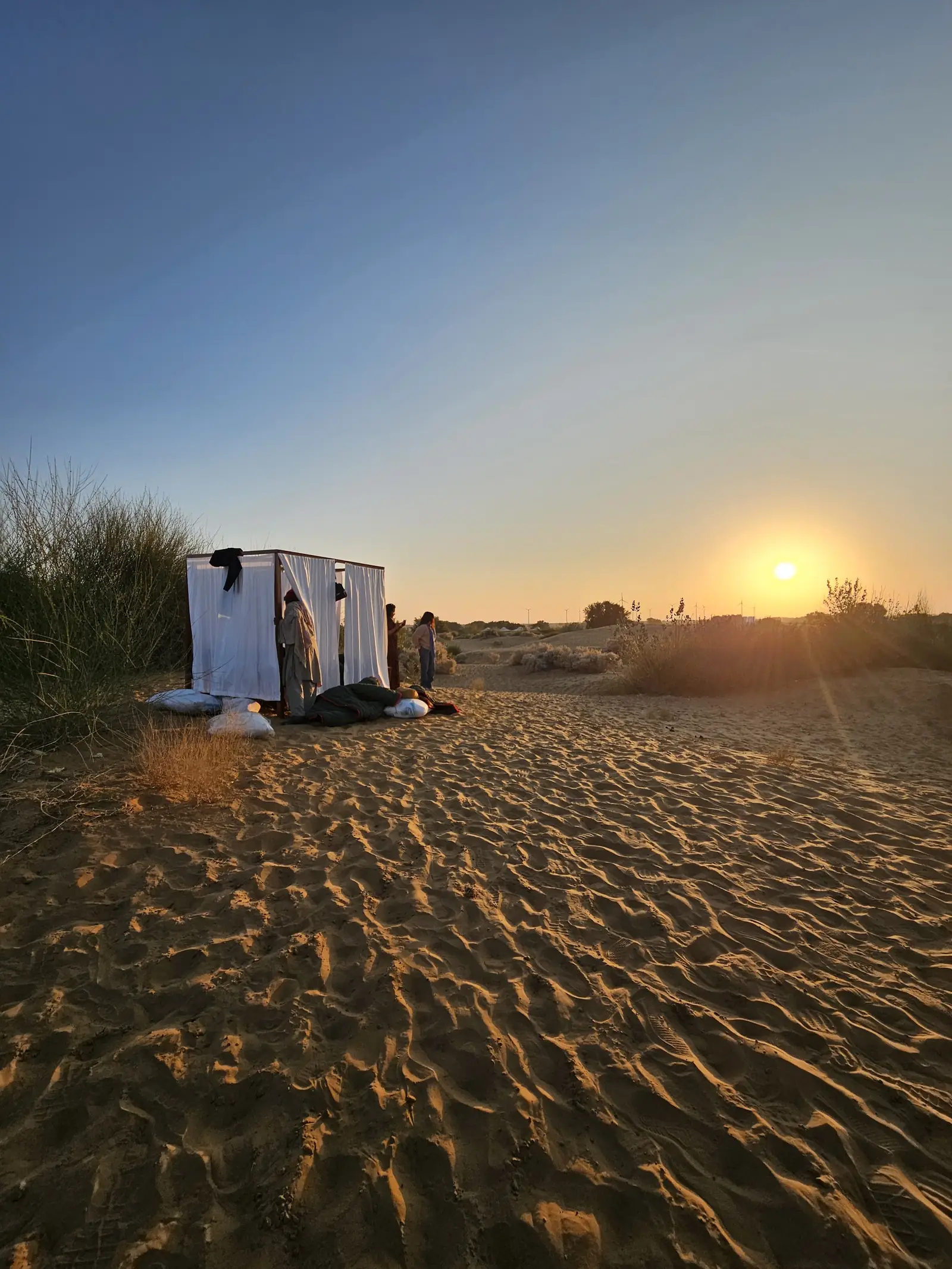 First light on the rippled sand, the camp shelter still in shadow