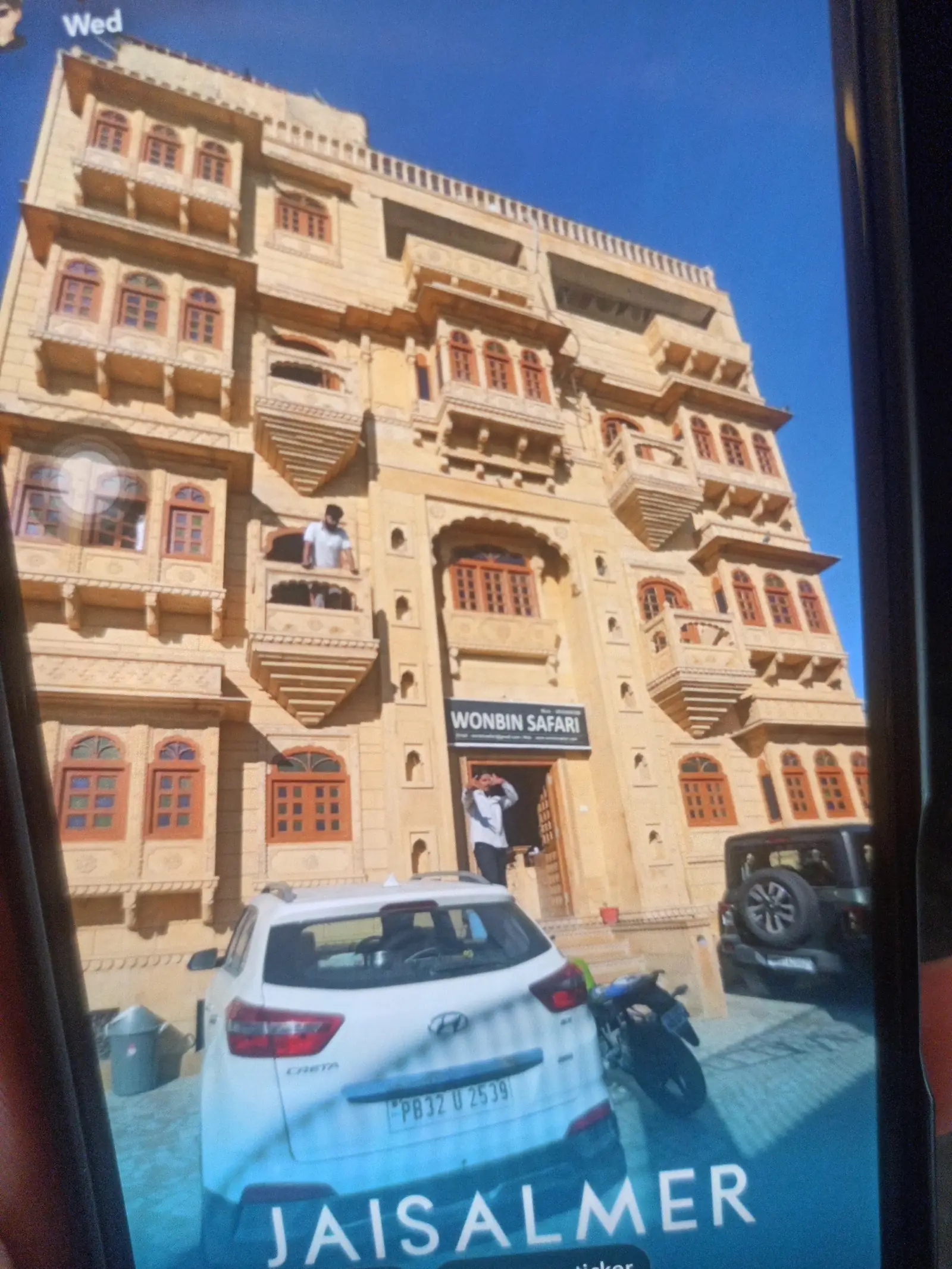 The hotel from the street, the Wonbin Safari sign over the door