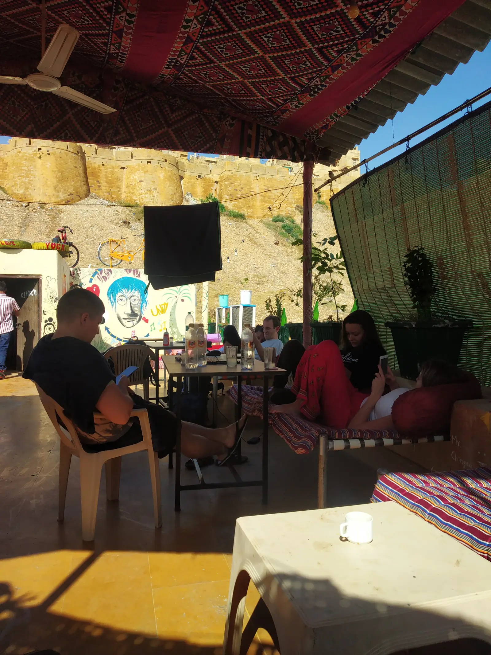 Guests eating on the roof under the canopy