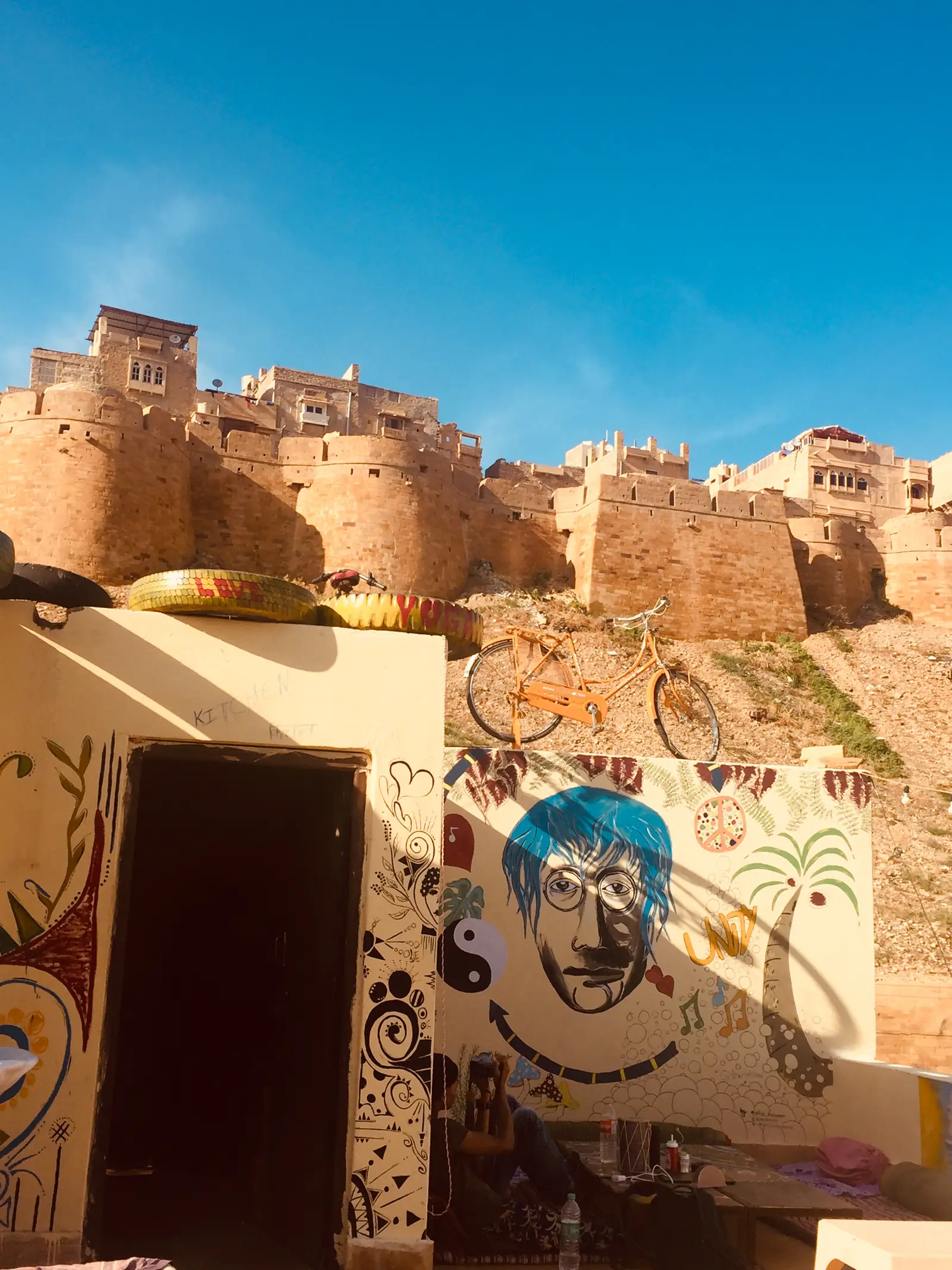 A painted wall on the roof with the fort beyond