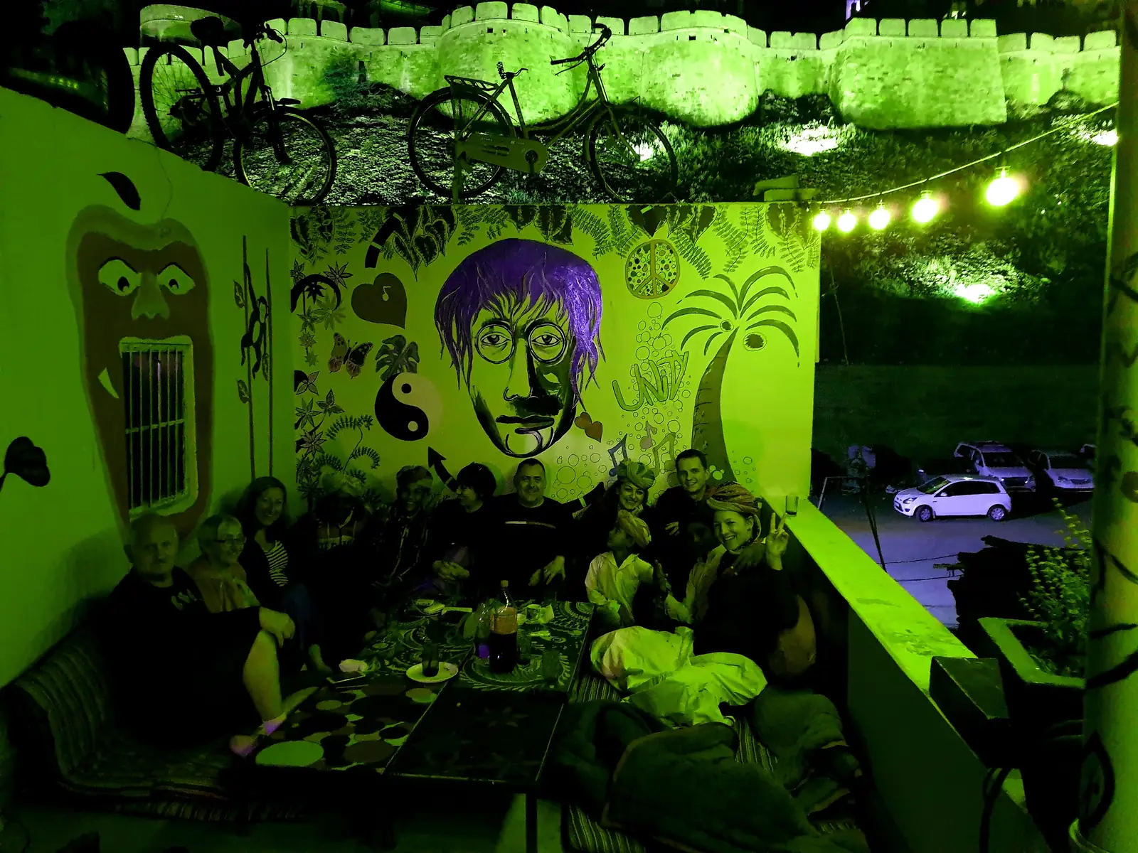 The painted common room, lit green at night