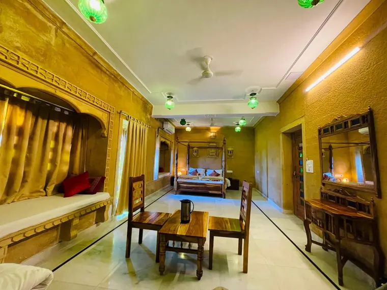 A long seating room with carved stone arches at the hotel