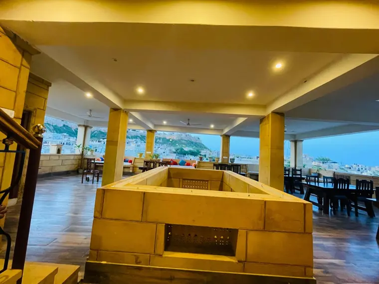 The covered end of the hotel rooftop, set for meals